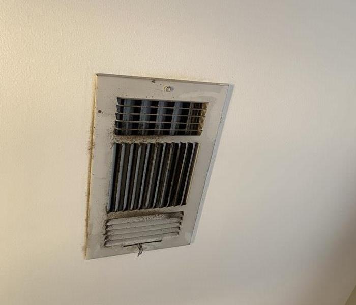 Filthy AC vent that has been collecting dust and needs to be cleaned